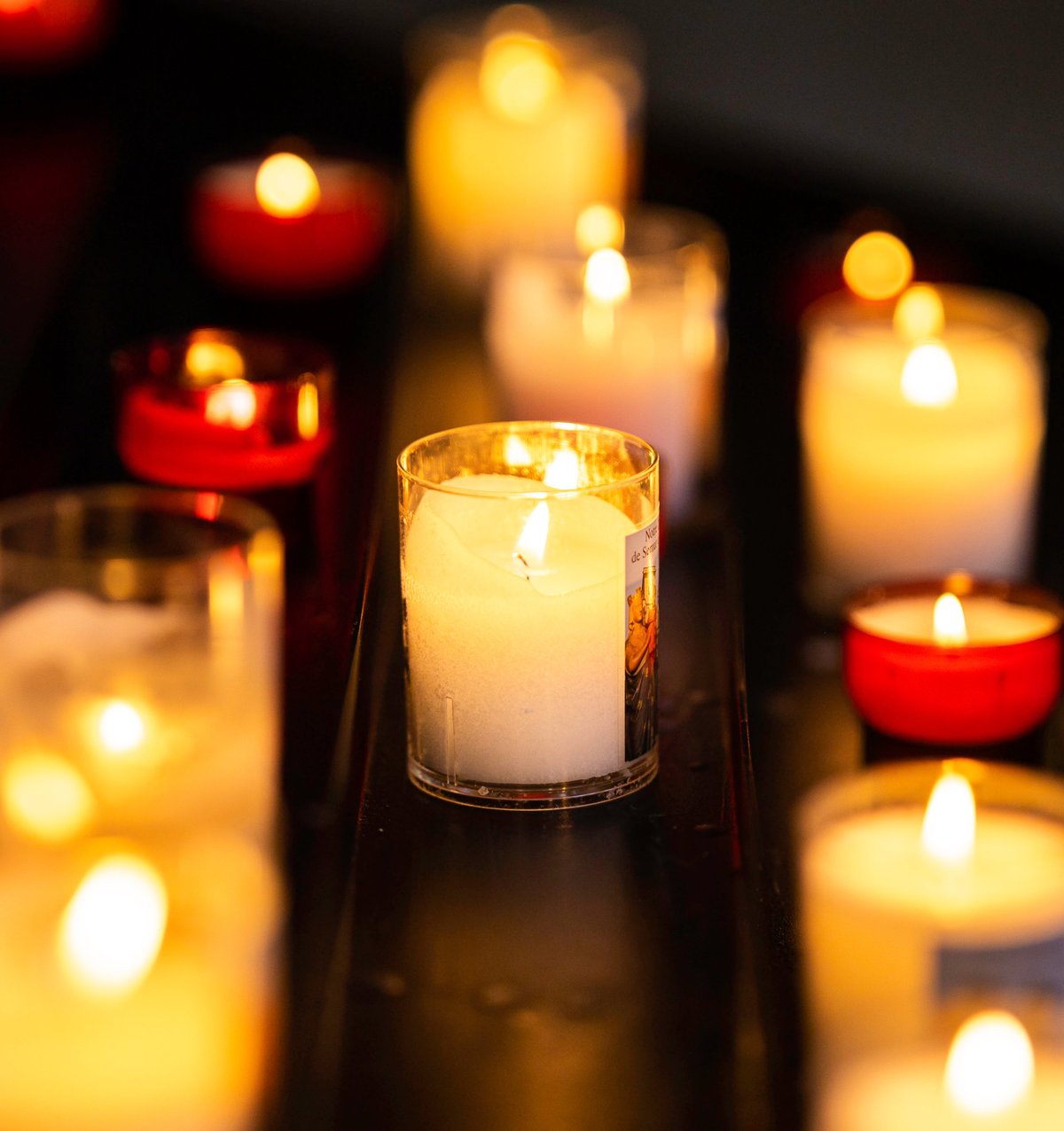 Candles glowing in a quiet, private room
